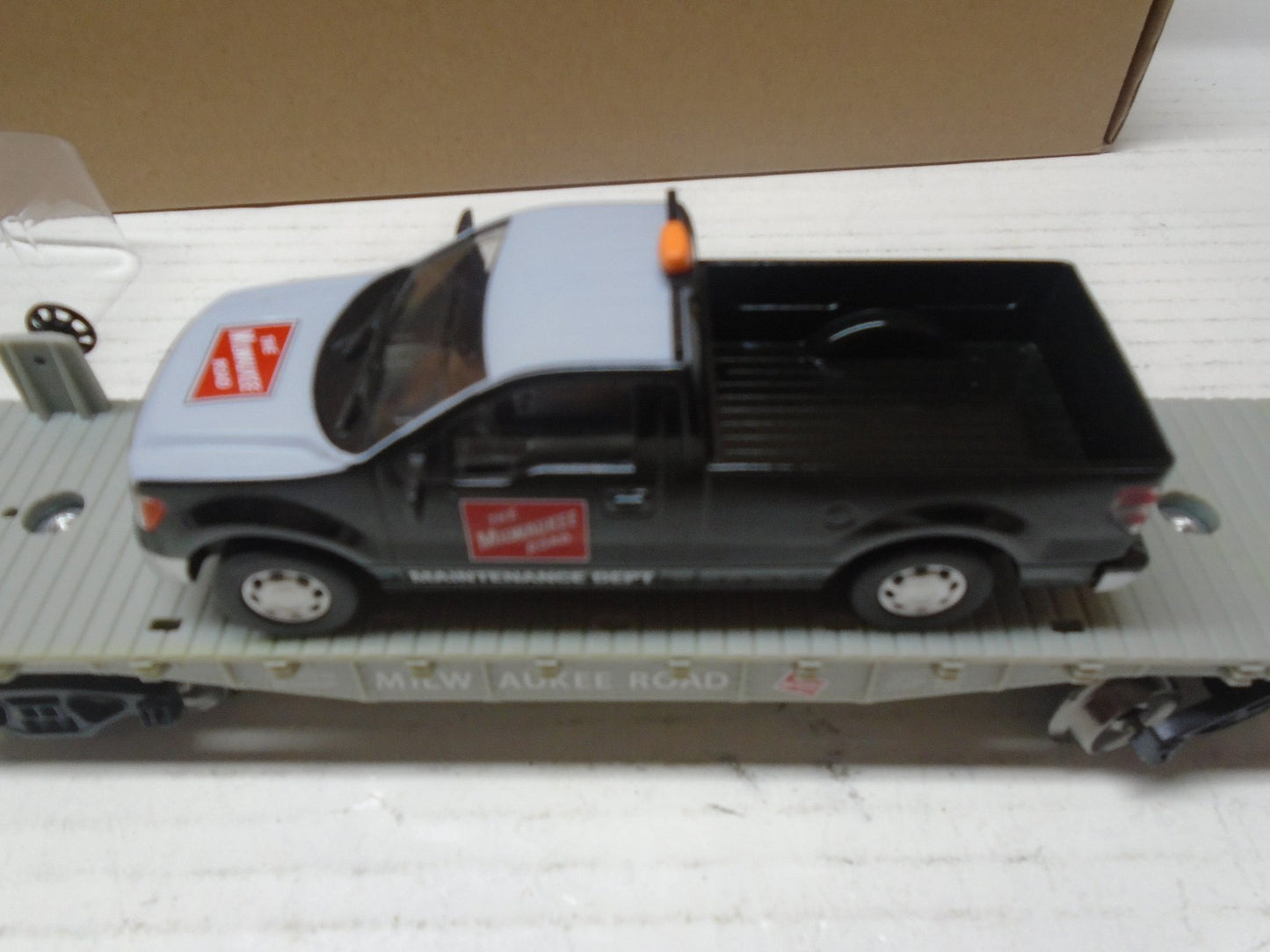 Menards O Scale Flatcar with Milwaukee Road F150 Maintenance Truck