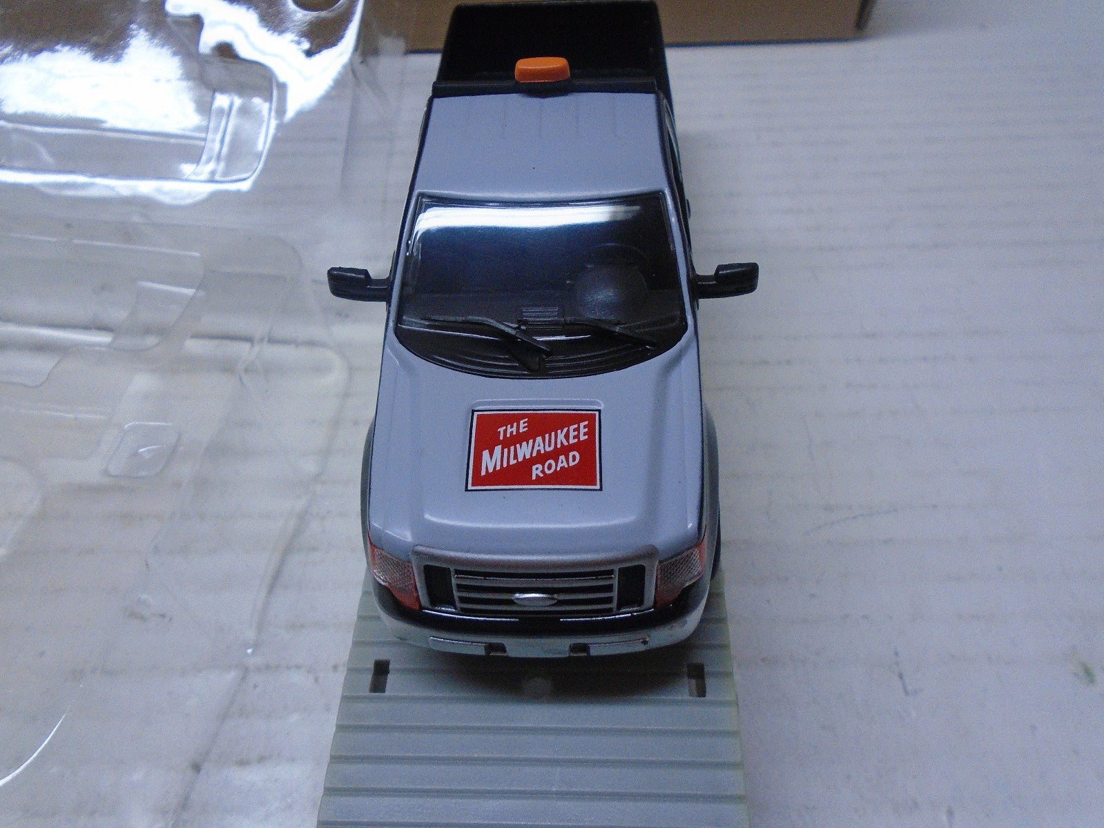 Menards  O Scale (4) Flatcar with Milwaukee Road F150 Maintenance Truck