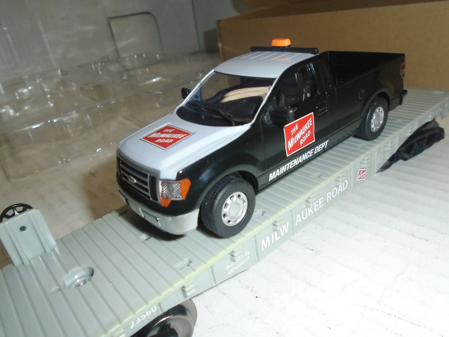 Menards  O Scale Flatcar with Milwaukee Road F150 Maintenance Truck