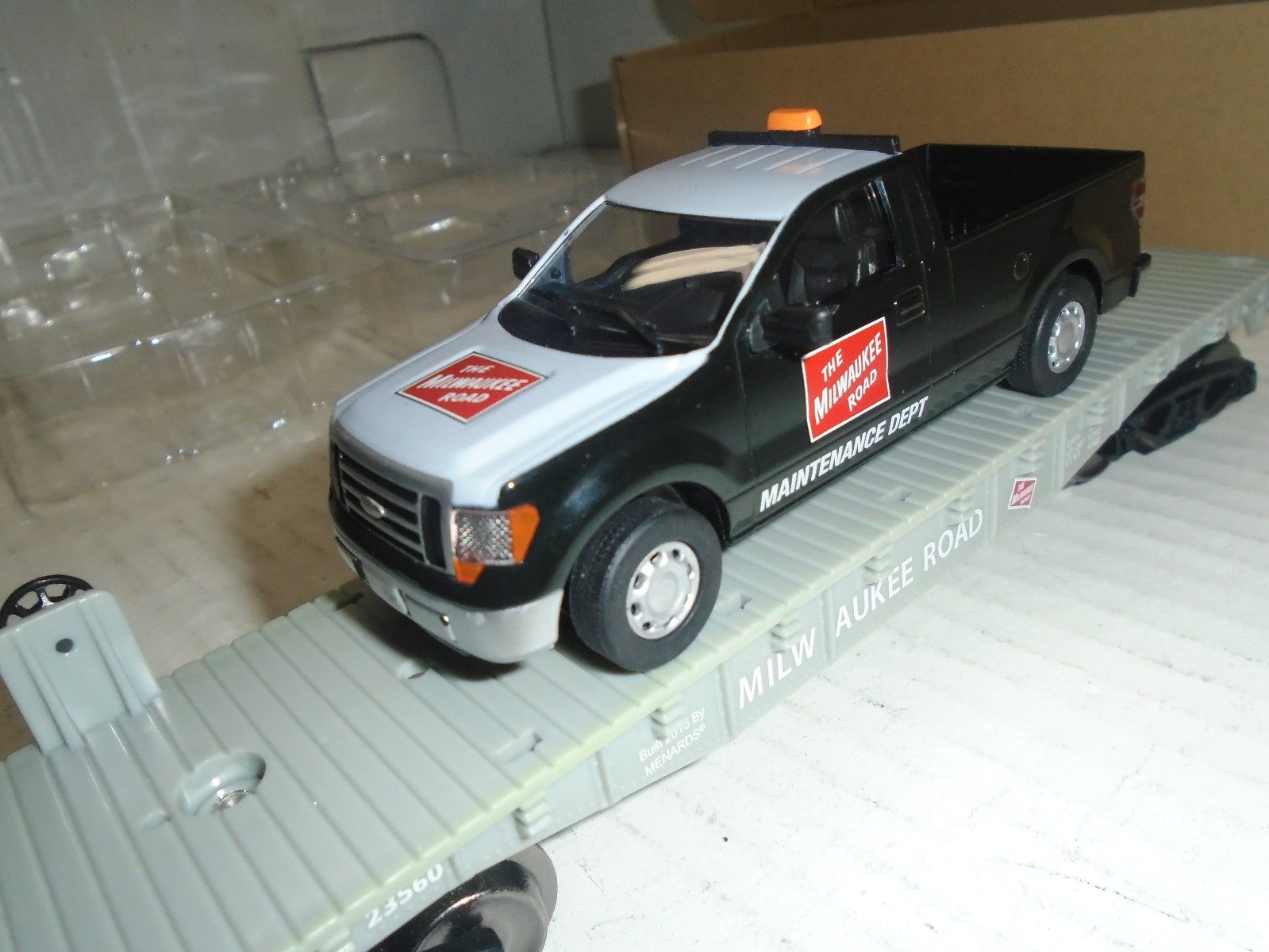 Menards  O Scale (4) Flatcar with Milwaukee Road F150 Maintenance Truck