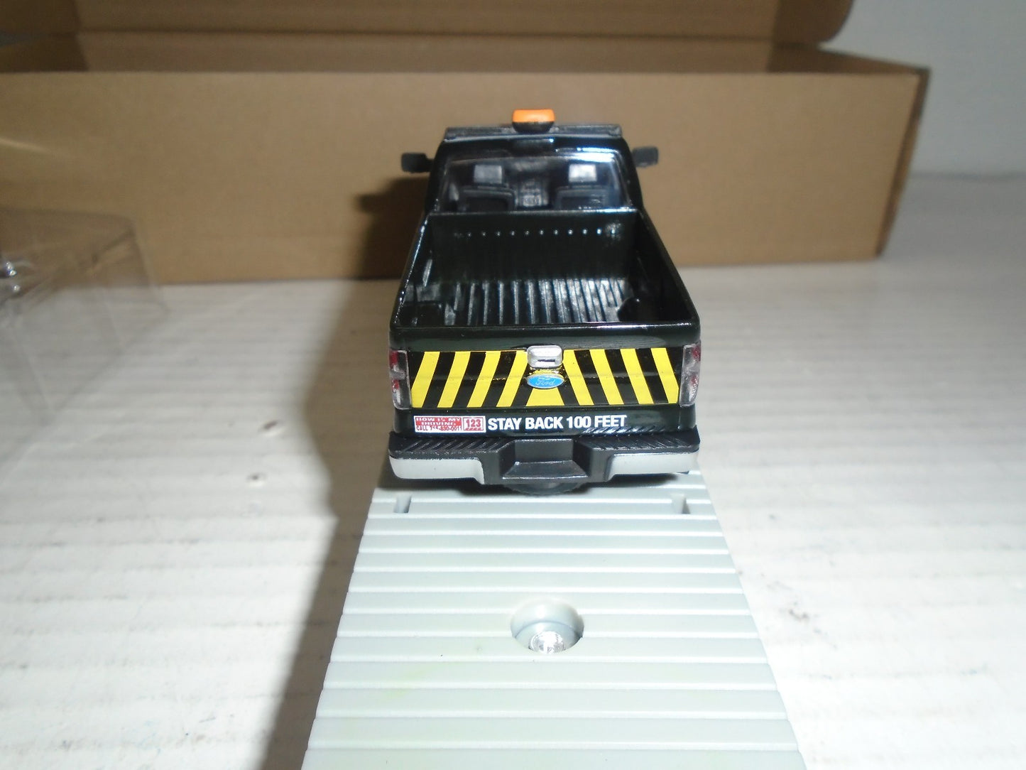 Menards  O Scale Flatcar with Milwaukee Road F150 Maintenance Truck